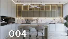 Minimalist kitchen interior with marble countertops and illuminated cabinetry.