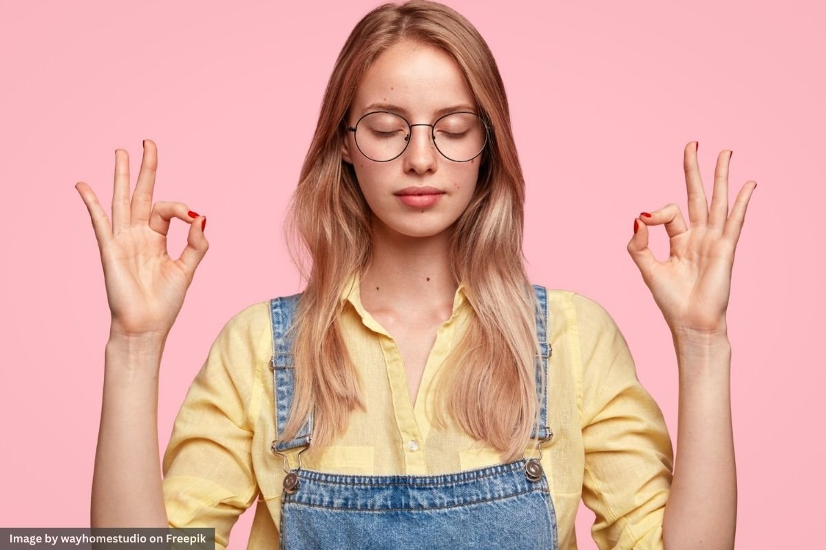 A portrait of a young blonde woman with a peaceful expression, symbolising willpower and self-control.
