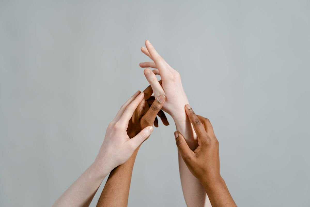 Close-Up of Hands Representing Support and Care Close-up of hands gently resting on each other, symbolising care, support, and emotional connection.