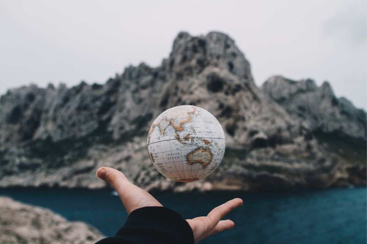 A Globe Tossed into the Air: Exploring Your Relationship with the World A person tossing a globe into the air, symbolising the dynamic relationship between individuals and the world they live in.