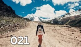 A woman walking alone on a hiking trail, symbolising the freedom and peace found in embracing solitude.