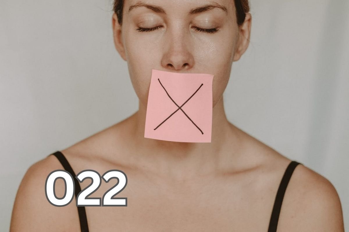 A woman with a yellow sticker note displaying a black X on her mouth, symbolising the importance of silence and discretion.