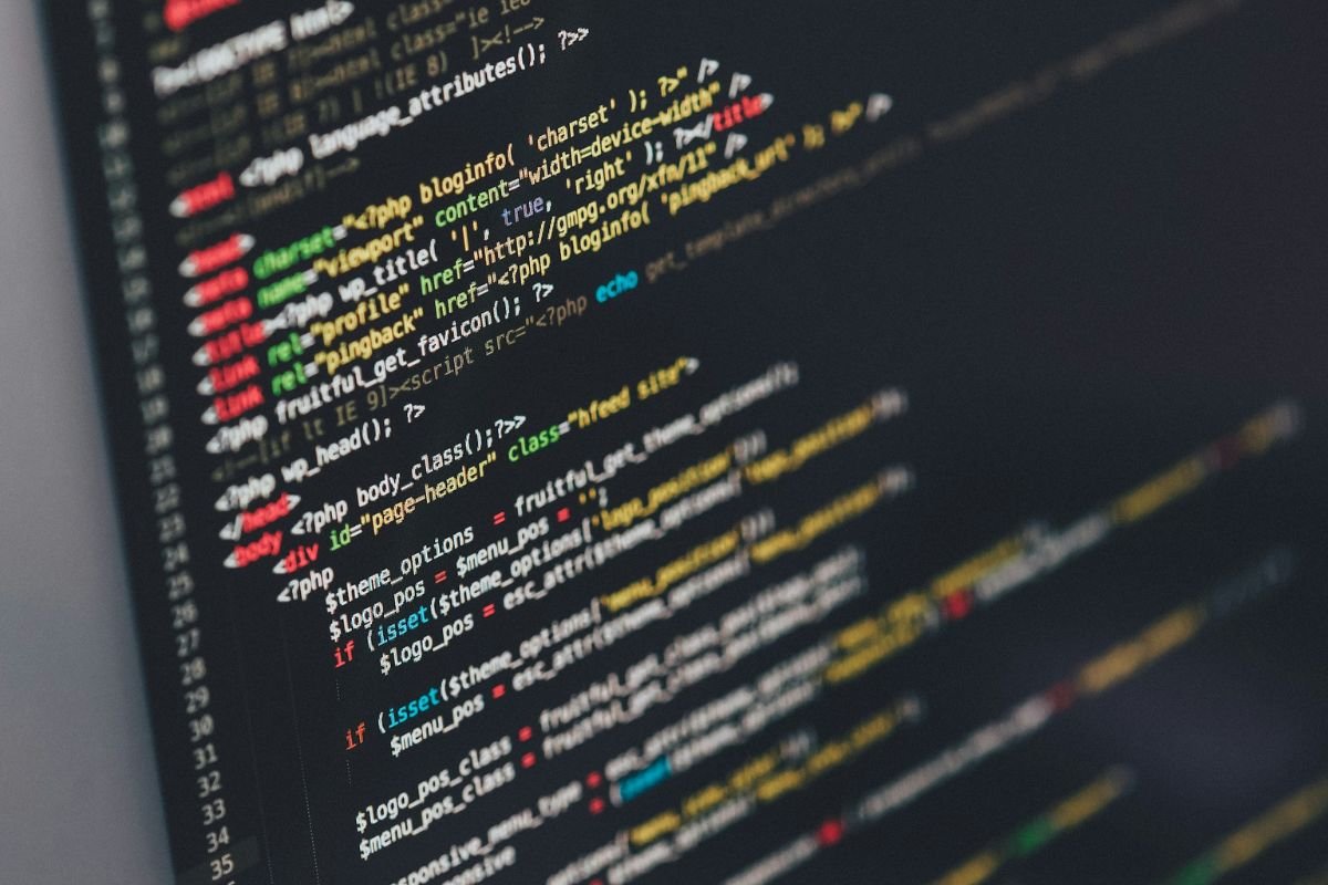 Algorithms at Work: Analysing User Behaviour for Tailored Content Computer screen displaying complex code, representing algorithms that analyse user behaviour to deliver targeted content and advertisements.