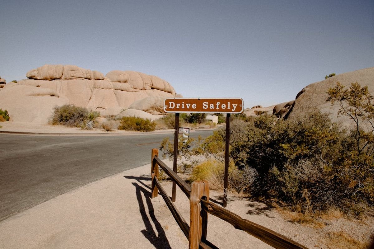 Drive Safely: The Power of Small Commitments A road safety sign with the words "Drive Safely" in bold letters, symbolising commitment and public responsibility.
