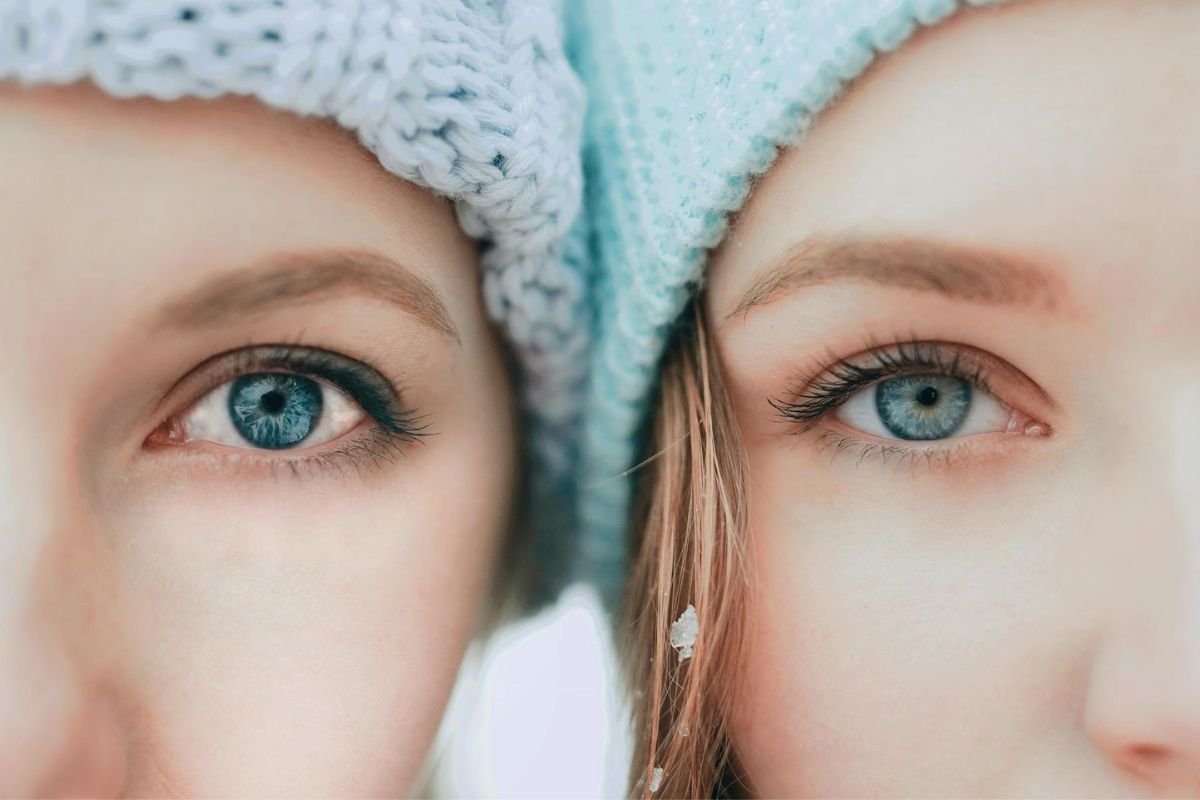 Gazing Eyes: Exploring the Physiological Effects in Attraction A woman wearing a blue knit cap, gazing softly, symbolising the emotional impact of eye contact and its role in attraction.