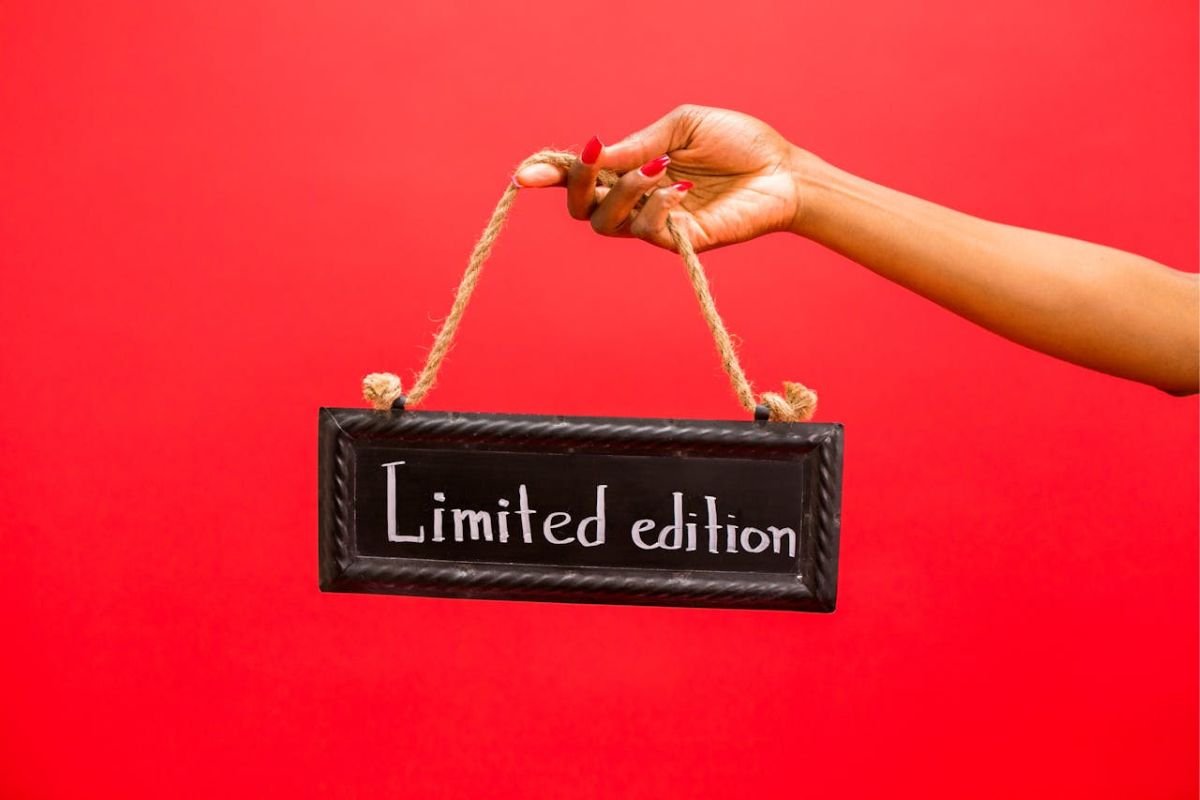 Chalkboard Highlighting Scarcity: The Power of "Limited Edition" A chalkboard held by a person, featuring the text "Limited Edition," symbolising the psychological impact of scarcity.