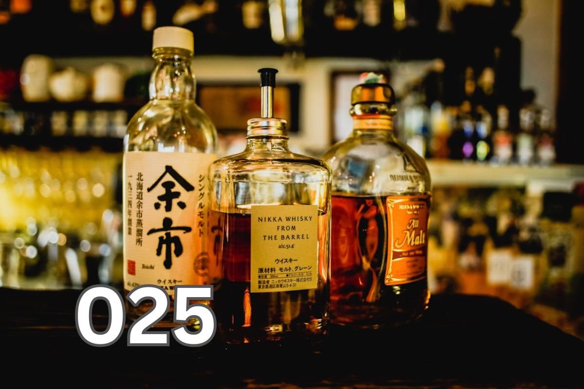 Three assorted liquor bottles on a table, symbolising the human relationship with alcohol through history.
