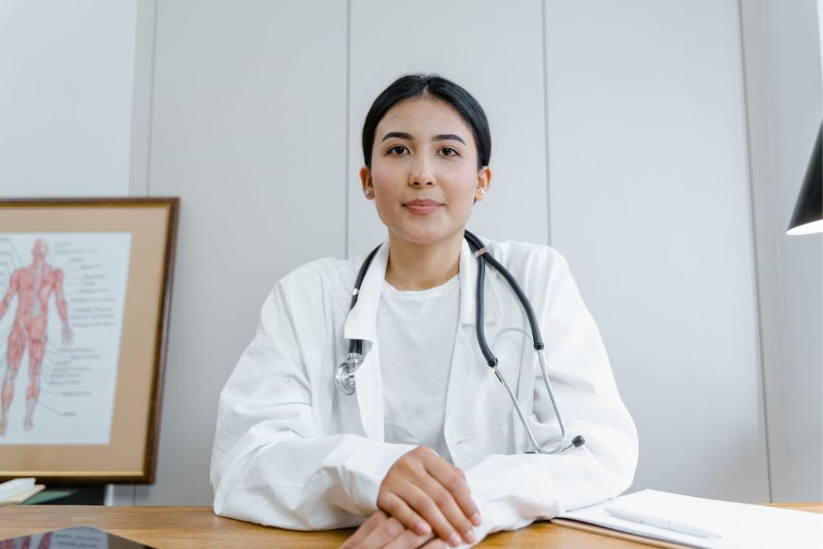 The Doctor: A Companion Who Stays With You Until the End A doctor in a white scrub suit with a stethoscope, representing the unwavering support and care doctors provide in life’s critical moments.