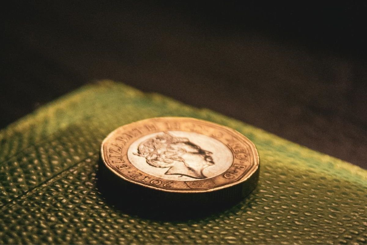 The Companion You Can Always Count On: A Reflection on Money A close-up image of a British £1 coin placed on a neutral surface, symbolising financial security and reliability.
