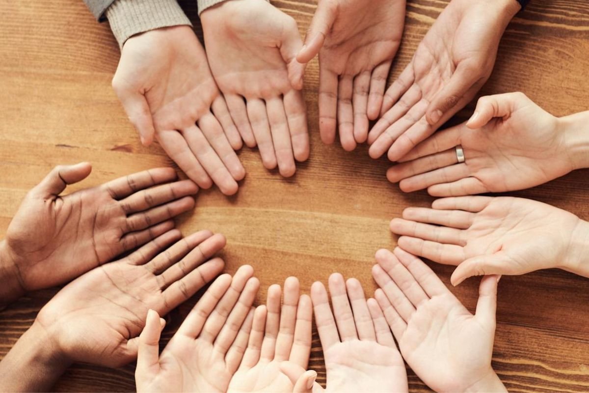Multiple hands with open palms facing upwards, representing financial choices, responsibility, and the power to shape one’s financial future through mindset and smart decisions.