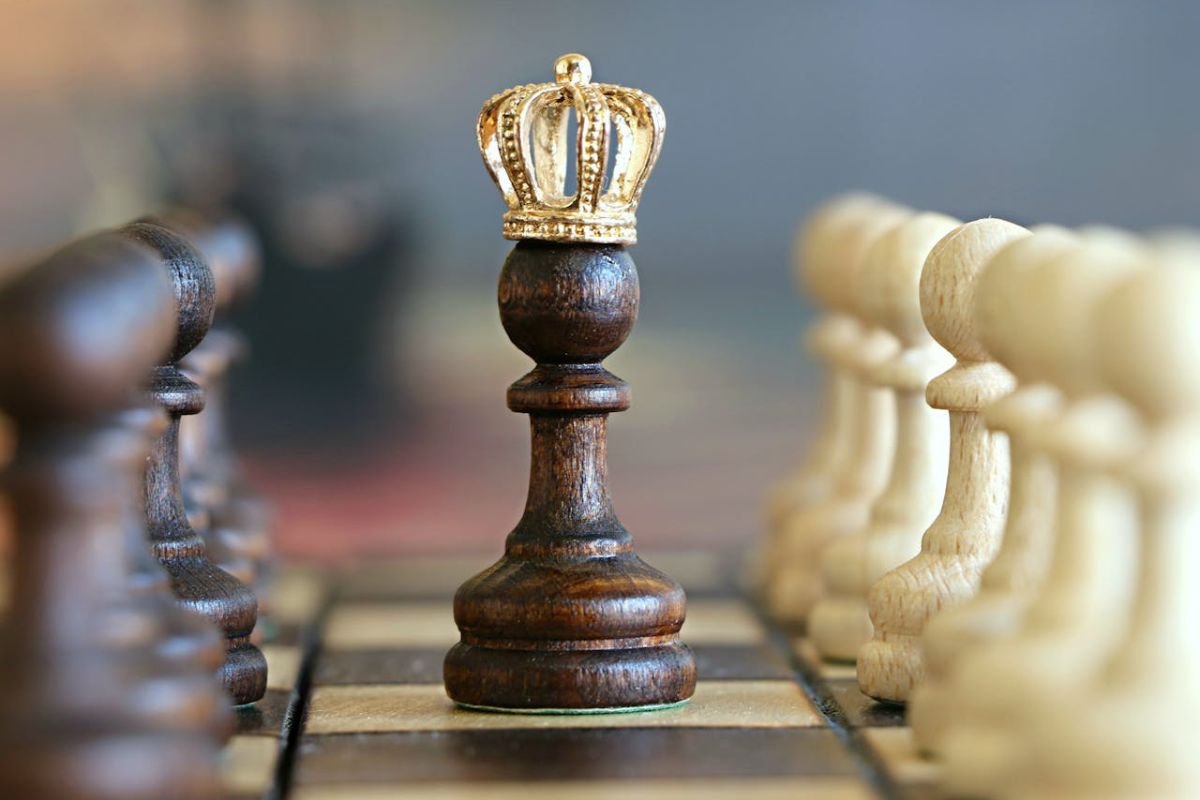 The Crowned Pawn: How Mindset Shapes Greatness A pawn chess piece with a gold crown, depicting how the right mindset can elevate anyone to greatness.