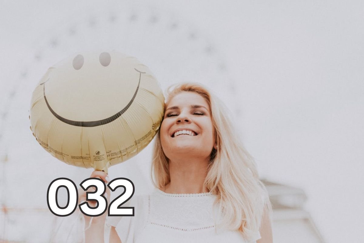 A Heart Lifted by Happiness – The Power of Five Joyful Sentences A smiling woman holds a bright yellow smiley face balloon, symbolising joy and a heart uplifted by five happy sentences.