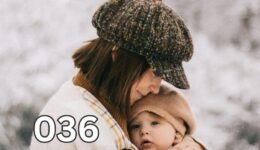 Mother lovingly embraces child outdoors during winter, wrapped in a warm coat and connection.