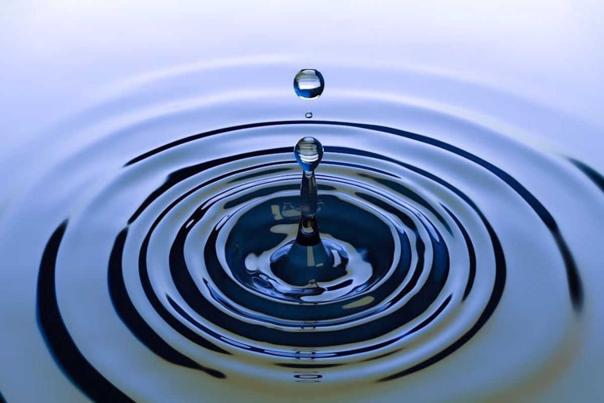 The Ripple Effect: How Your Words Shape Relationships and Influence Conversations A water droplet creates ripples, illustrating how words and communication choices have a lasting impact, shaping relationships and interactions.