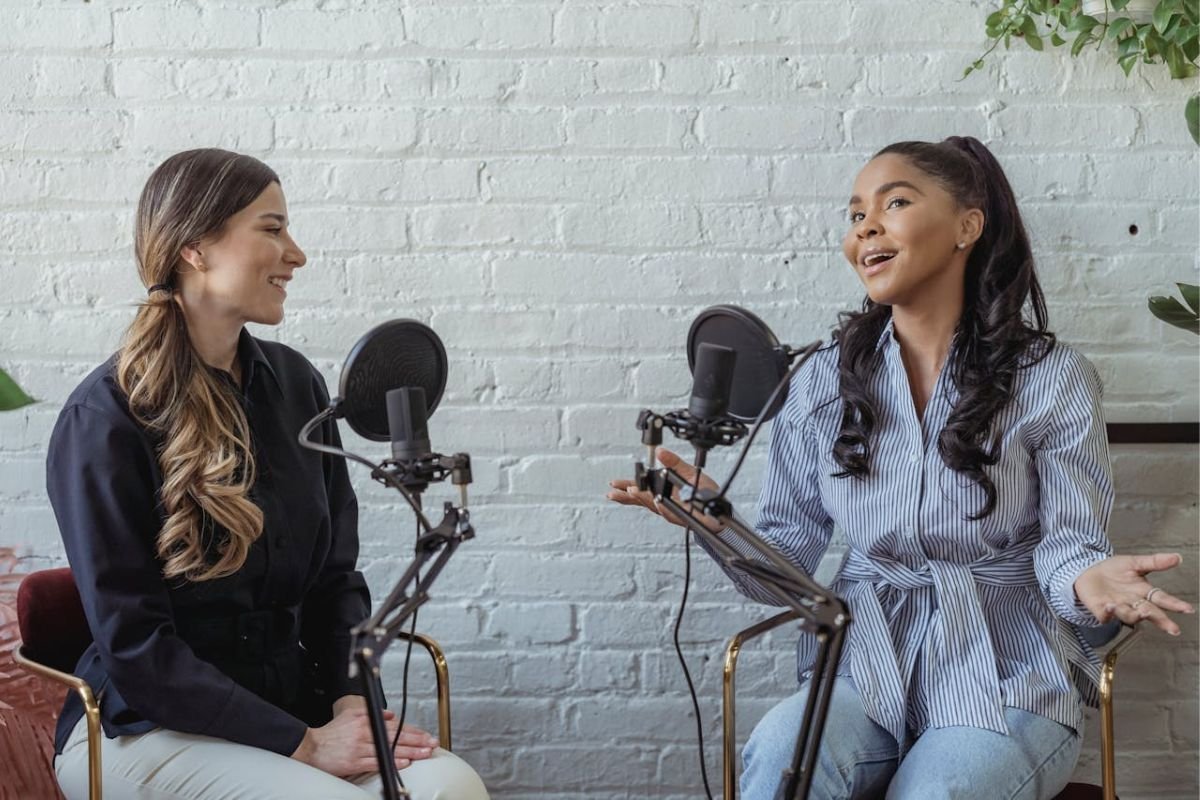 The Secret to Meaningful Conversations: Emotional Intelligence in Action A woman attentively listening to a radio host, demonstrating the power of emotional intelligence in creating meaningful discussions.