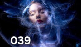 A woman surrounded by glowing energy waves, symbolising the deep connection between emotions and energetic fields.