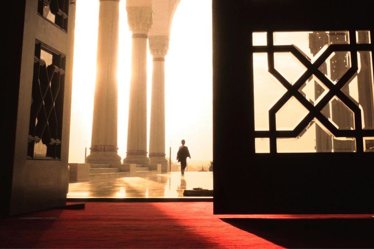 The Search for Meaning - A Door That Once Opened, Changes Everything A person has stepped through an open door into bright sunlight, symbolising the journey of searching for meaning and how it transforms one’s perspective forever.