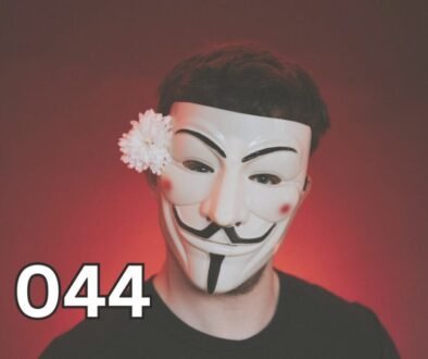 Person wearing a Guy Fawkes mask with a flower, symbolising hidden traits of antisocial personality disorder.