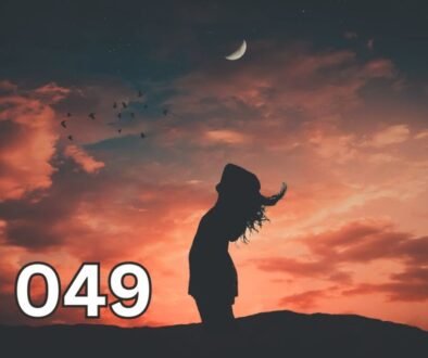 Silhouette of a woman under a dreamy twilight sky with moonlight and birds, symbolising the magic of lucid dreaming.