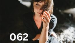 Woman smiling confidently after lifting her mood and finding happiness during tough times.