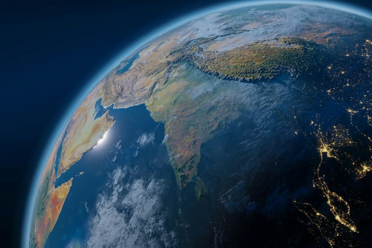 View of Earth from space showing vibrant blue oceans and white clouds.