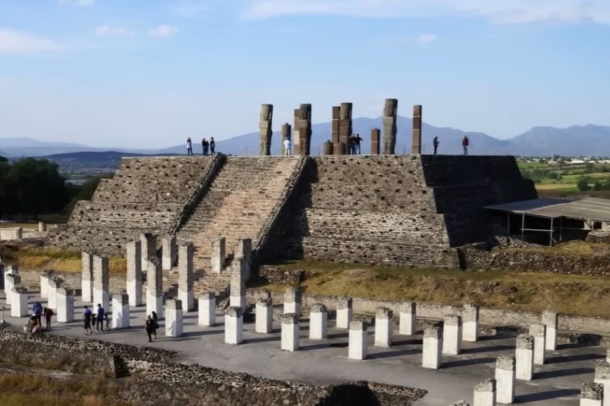 Ancient Pyramid B at Tula ruins in Mexico with four Atlantean warrior statues on top.