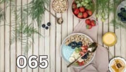 Yoghurt bowl topped with fresh fruit and berries, symbolic of probiotic-rich breakfast