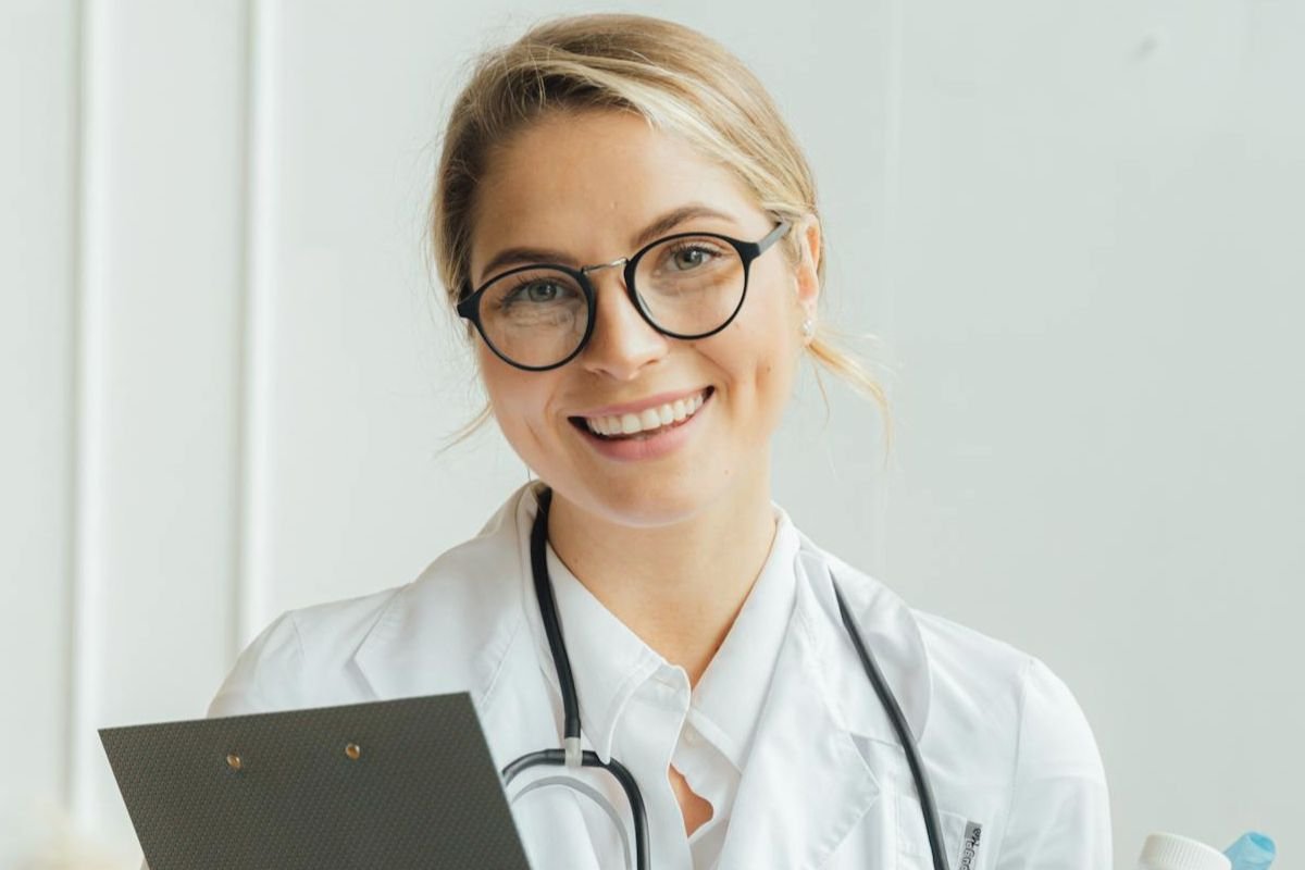 Doctor holding clipboard and medicine, healthcare worker in discussion