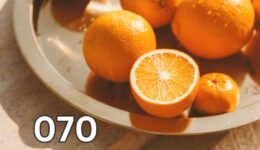 Close-up of fresh whole oranges on a table