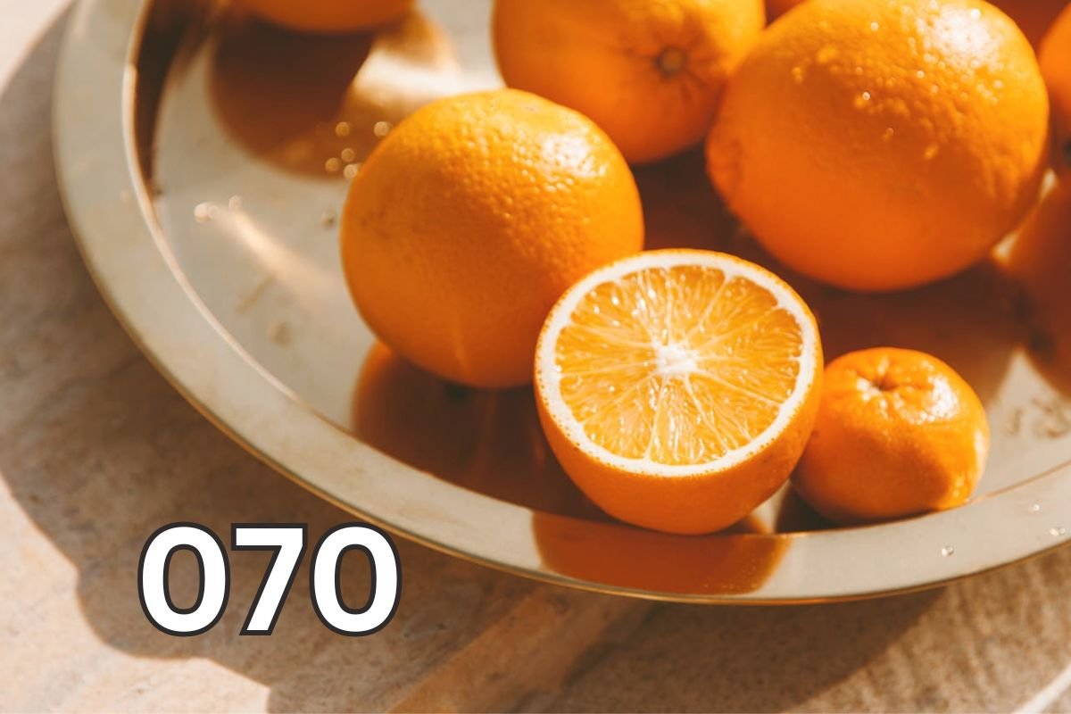 Close-up of fresh whole oranges on a table