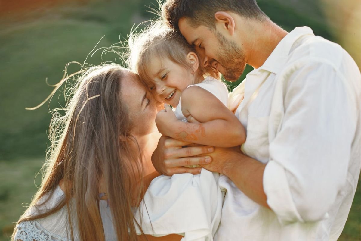 Loving family hugging together. Mother, father and daughter in warm embrace, representing emotional security