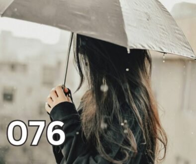 Woman standing in the rain holding an umbrella, symbolising self-reliance and learning to protect yourself through difficult moments.