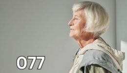 Elderly woman with eyes closed enjoying soft sunlight, symbolising wisdom and calm reflection in marriage advice.