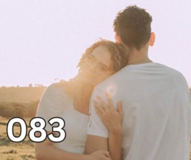 Woman leaning on her partner in an open field, illustrating emotional attachment despite distance.