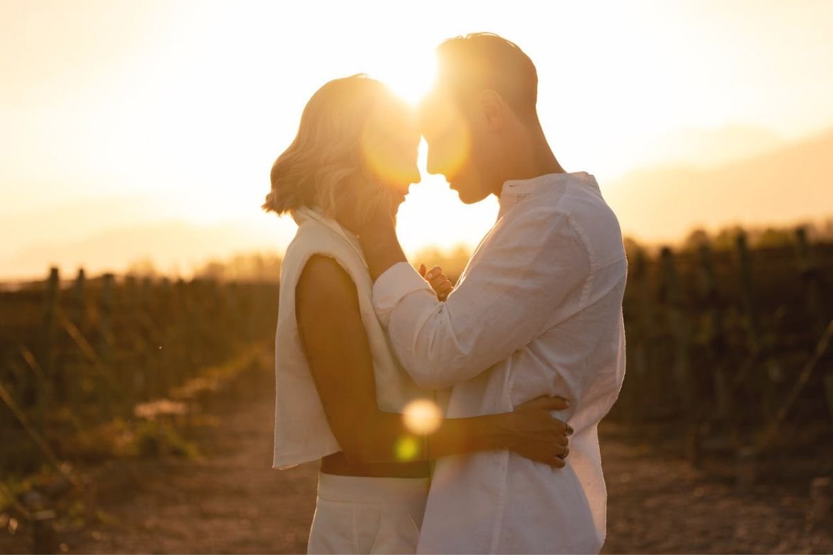 Couple embracing at sunset, capturing a moment of calm connection and hope for healthier love.