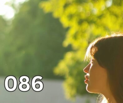 Woman standing in a sunny park with warm sunlight on her face, illustrating natural vitamin D production through sun exposure.