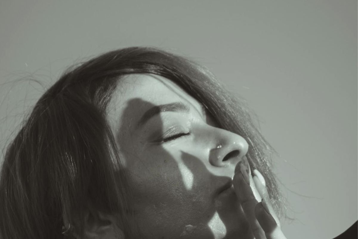 Woman with eyes closed and head raised, symbolising self-respect, inner clarity, and not seeking approval from others