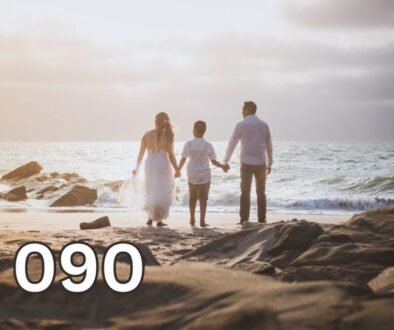Parents holding their child’s hands while walking together on a beach, symbolising emotional support, healthy parenting, and family connection.