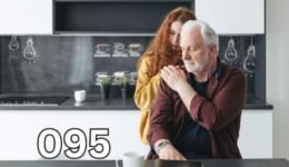 Adult daughter comforting her ageing father, reflecting the emotional impact of recognising the early signs of dementia in a loved one.