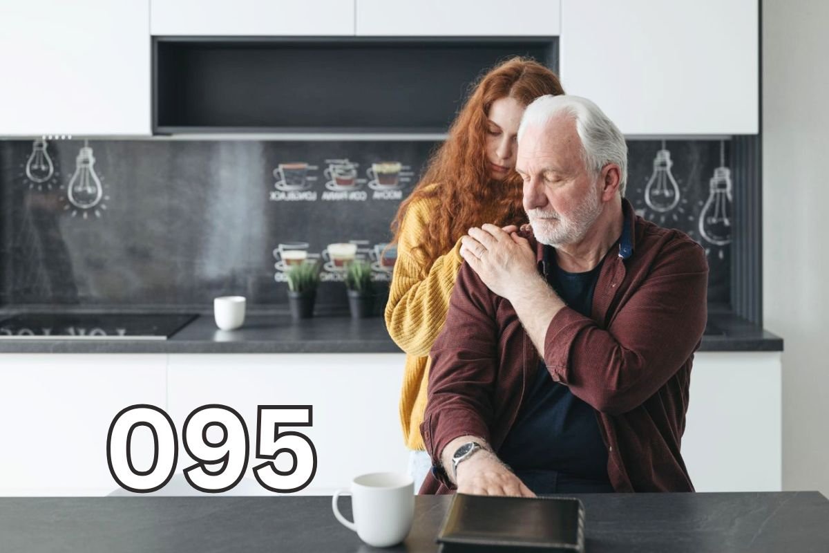 Adult daughter comforting her ageing father, reflecting the emotional impact of recognising the early signs of dementia in a loved one.
