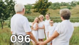 Parents of adult children standing with their children and grandchildren, representing family relationships, independence, and healthy ageing.