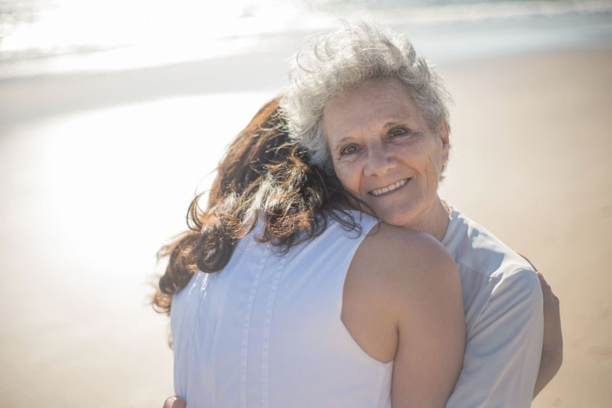 Adult daughter embracing her ageing mother, symbolising family support, compassion, and understanding when facing dementia symptoms.