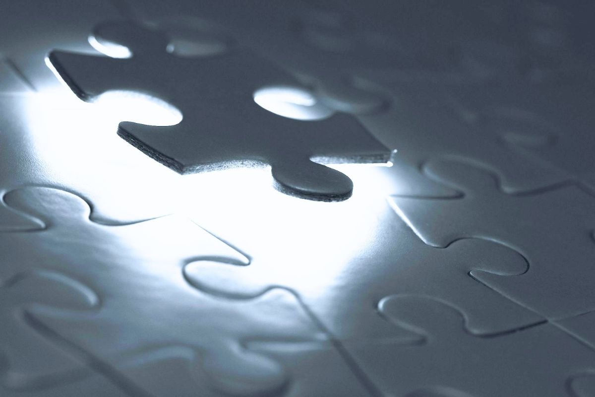 Puzzle piece completing a puzzle, symbolising how the brain may fill memory gaps during confabulation, a symptom associated with some forms of dementia.