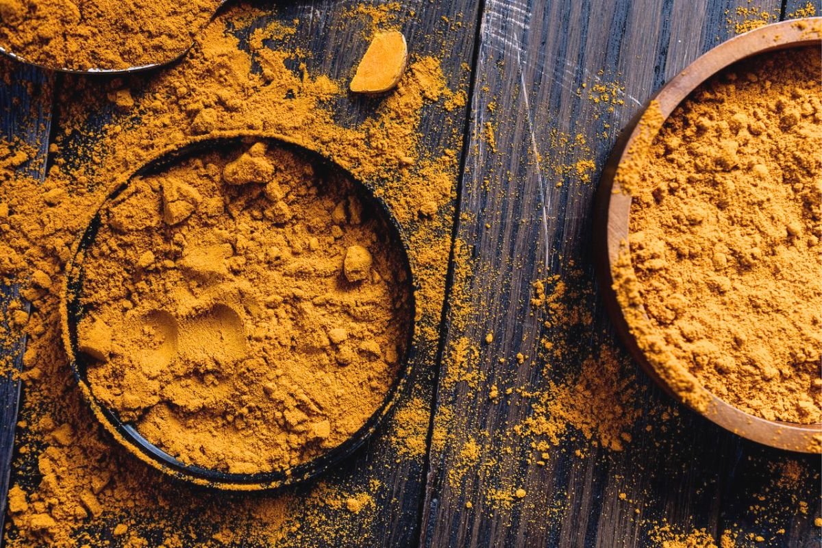 Ground turmeric powder, a natural spice that contains curcumin, the bioactive compound studied for its potential health benefits.
