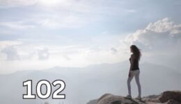 Woman standing on a cliff at sunrise, symbolising self respect, healthy boundaries, and the strength to stop being taken advantage of.