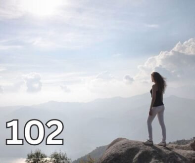 Woman standing on a cliff at sunrise, symbolising self respect, healthy boundaries, and the strength to stop being taken advantage of.