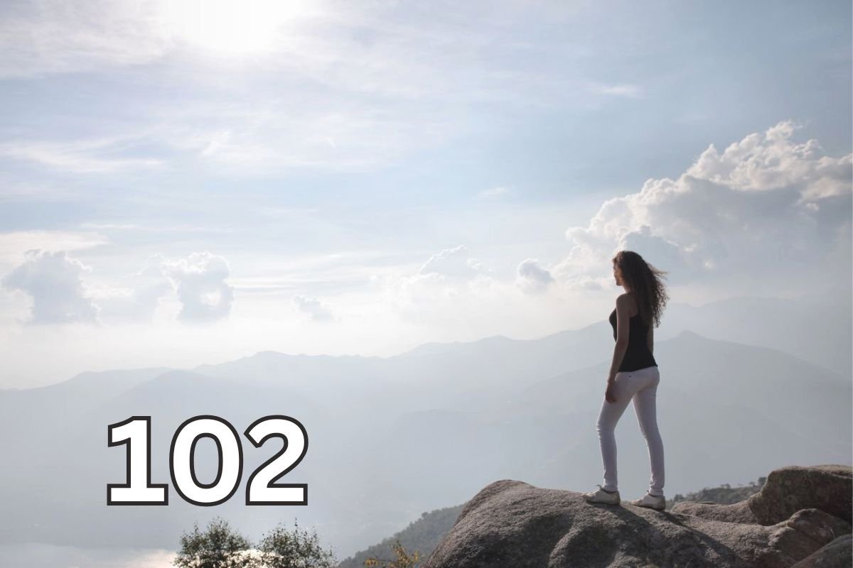 Woman standing on a cliff at sunrise, symbolising self respect, healthy boundaries, and the strength to stop being taken advantage of.