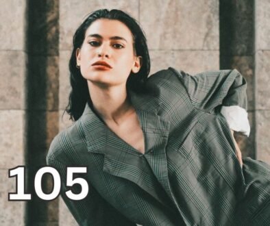 Woman posing confidently in an oversized suit