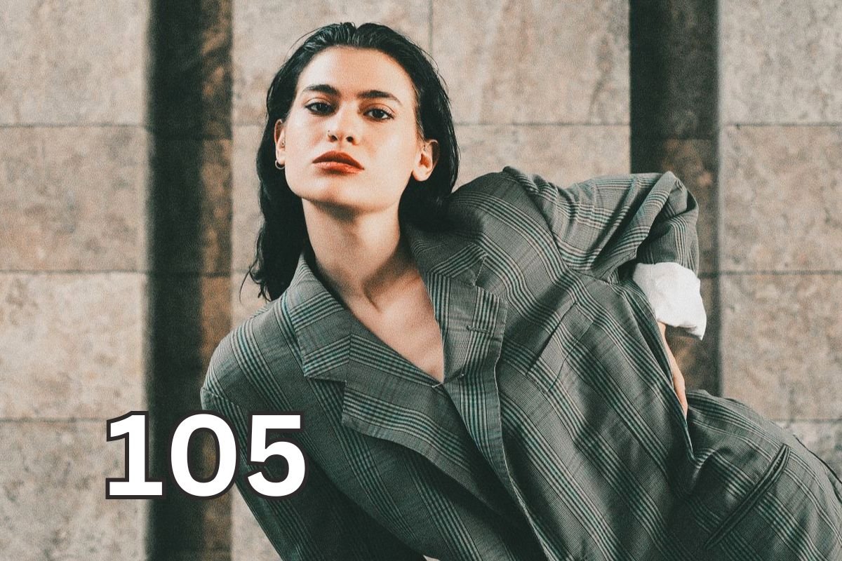 Woman posing confidently in an oversized suit