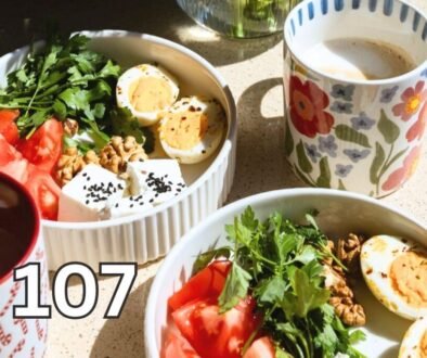 Healthy breakfast with eggs, fruit, coffee and flowers